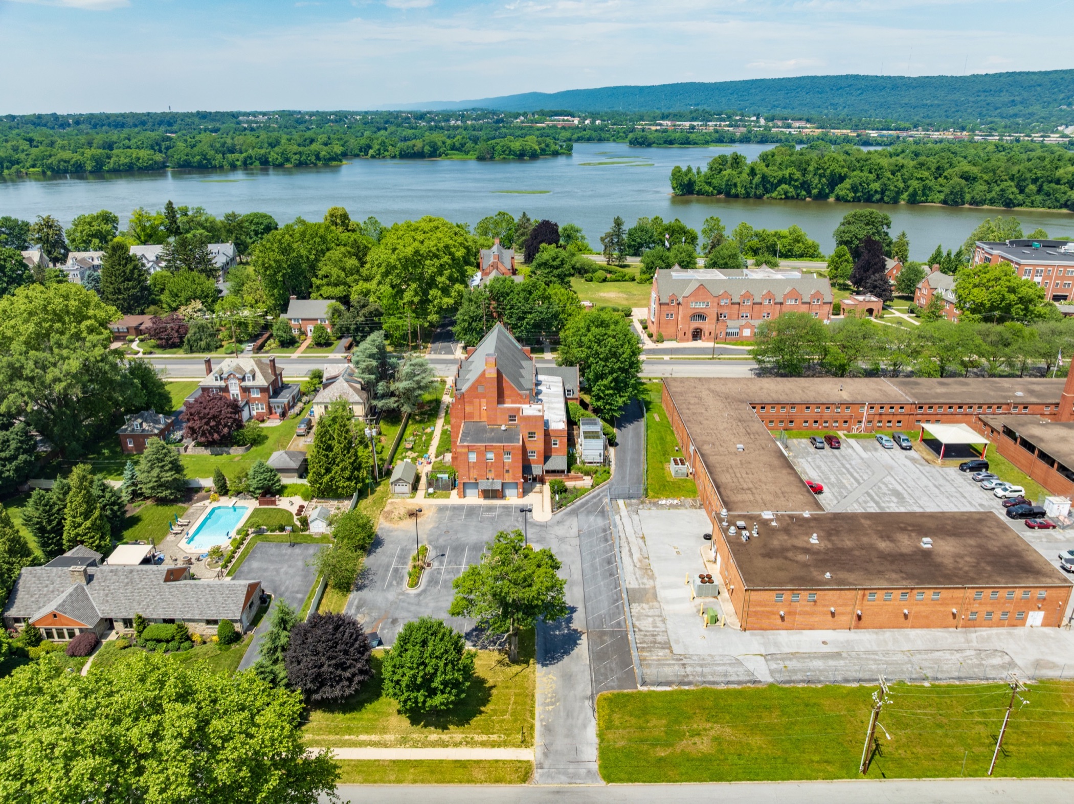 Aerial view of a brick institutional campus near the riverfront in Harrisburg