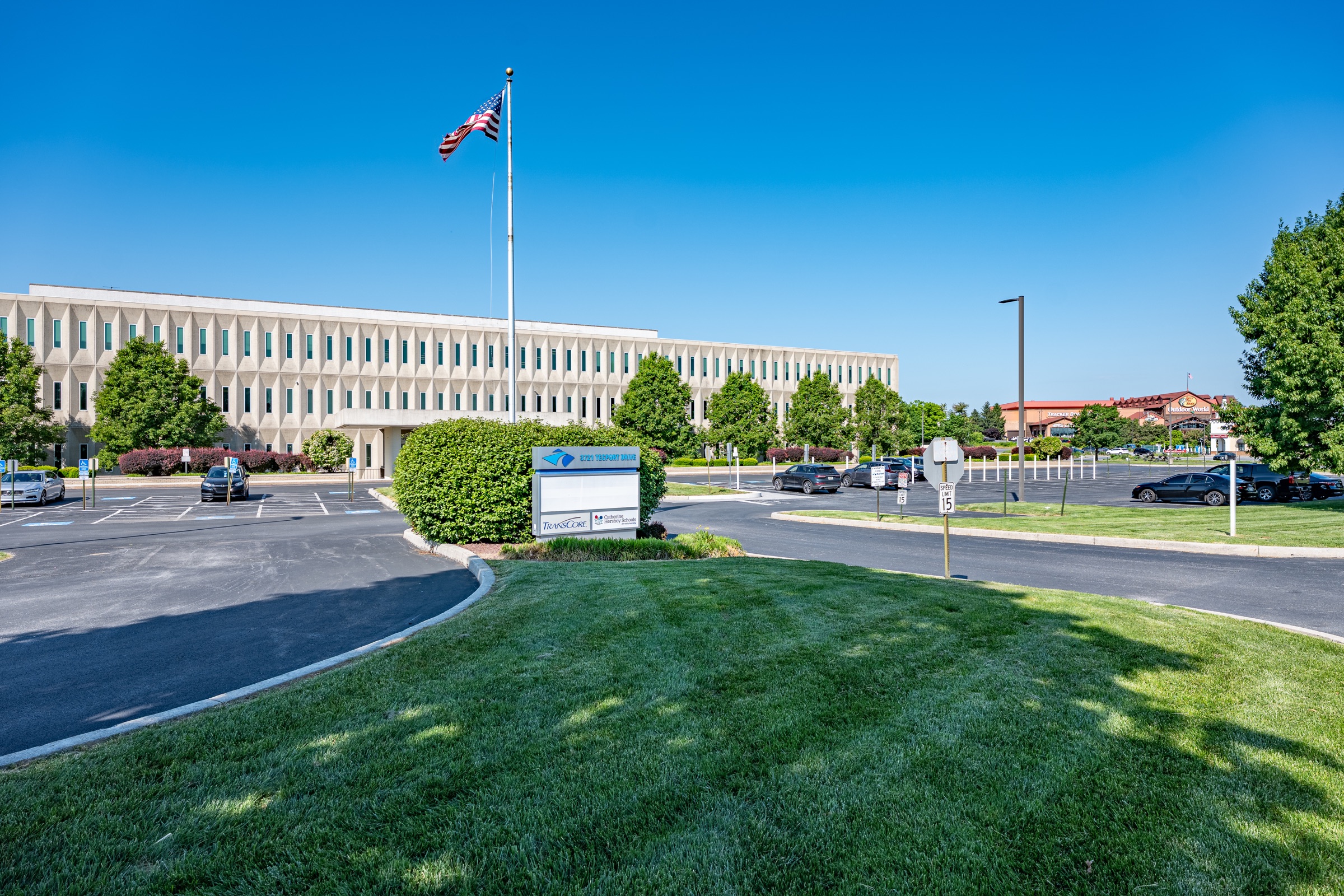 Contemporary office building seen from its landscaped entrance