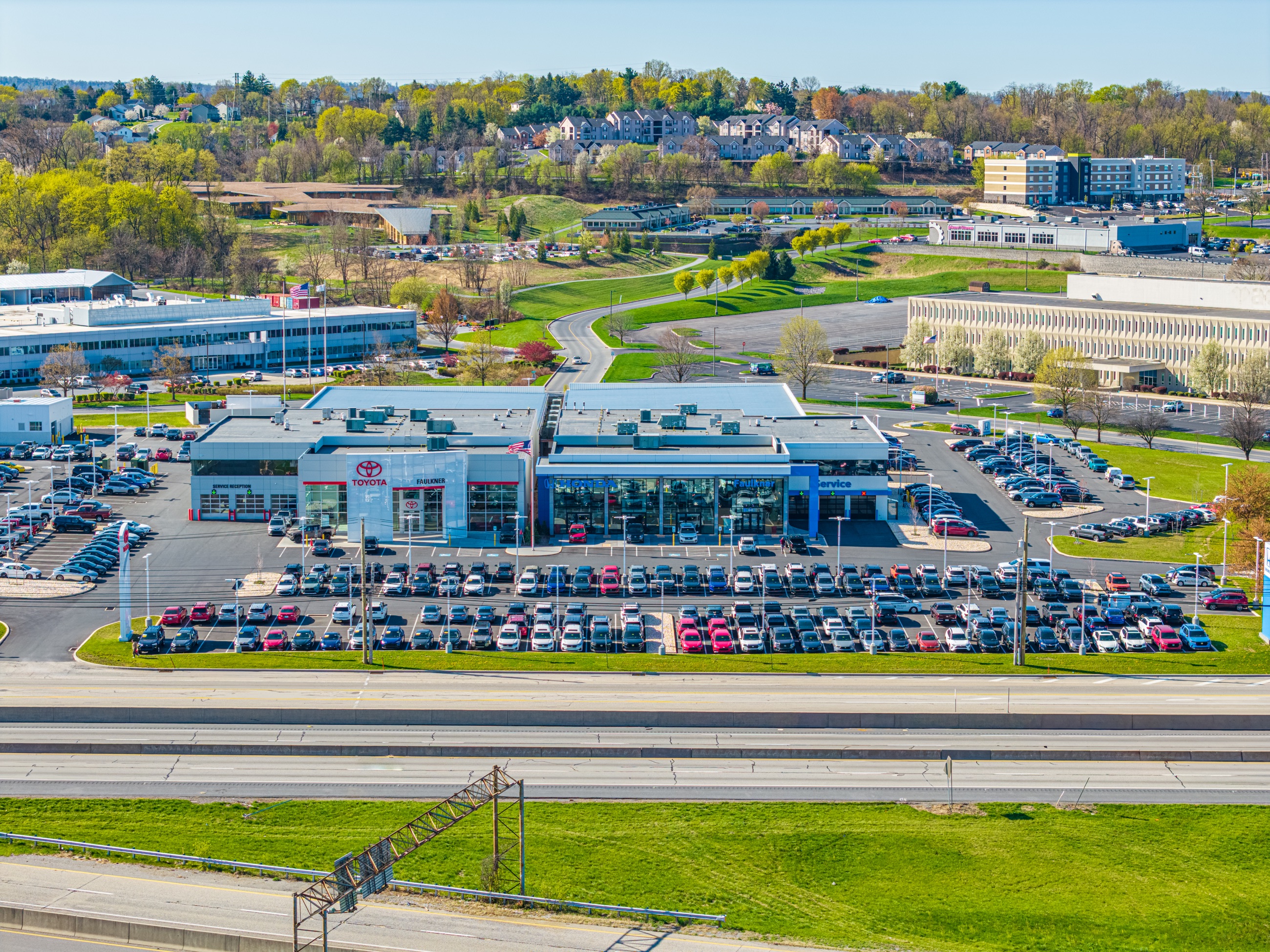 Aerial view of a retail automotive property along a commercial corridor