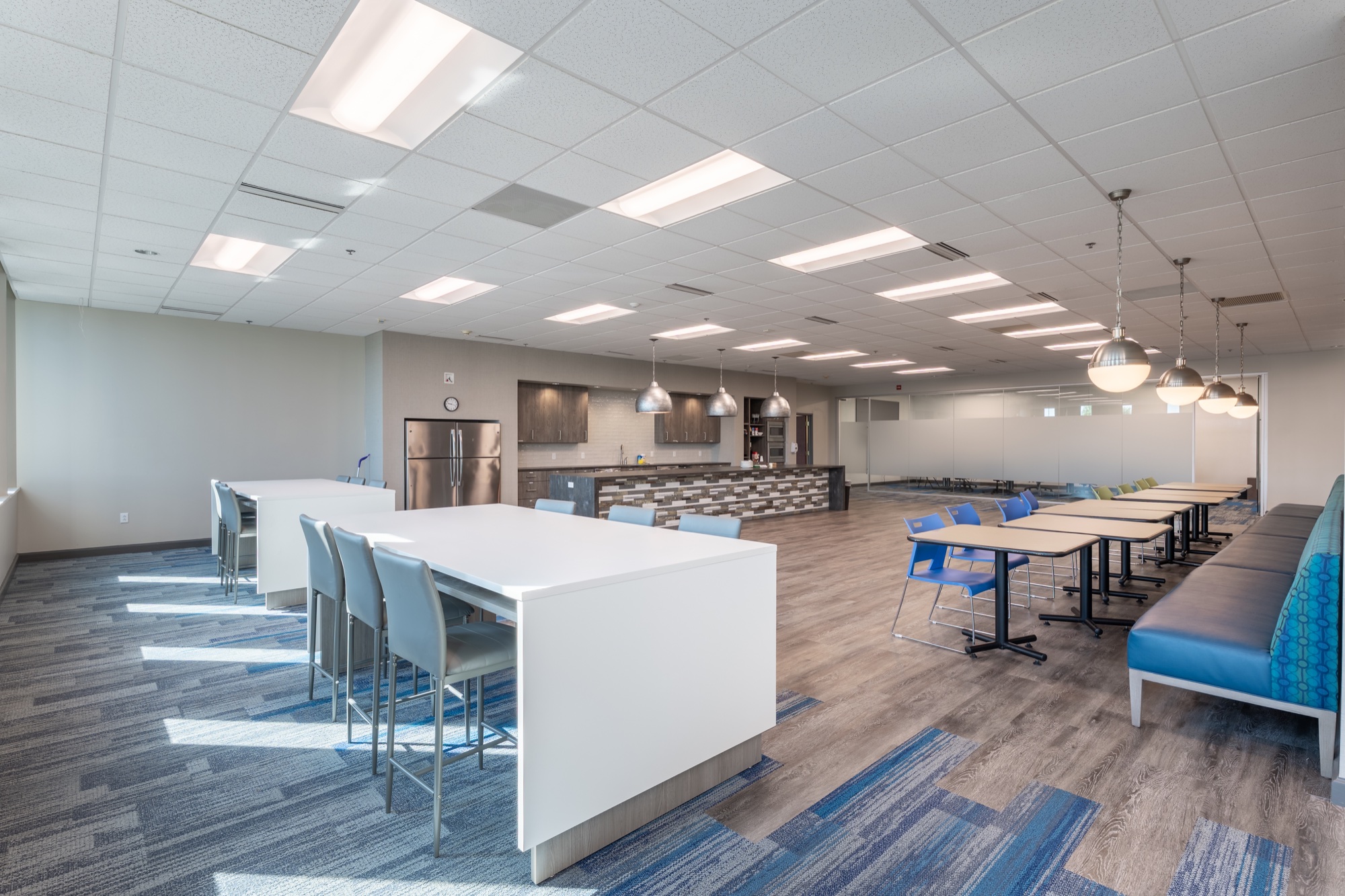 Open amenity space with café seating and a full kitchen